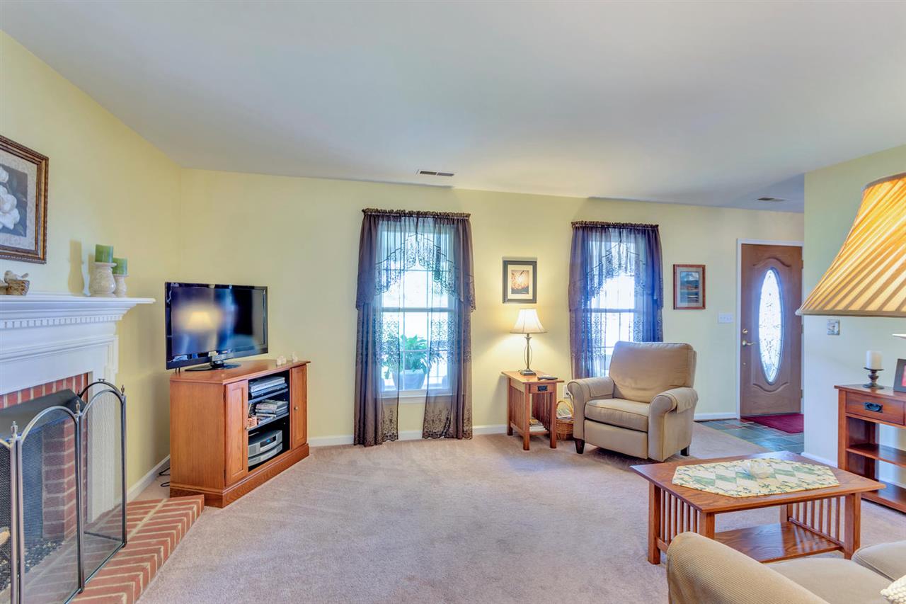 74 Spring Oaks Lane Ruckersville, VA 22968 - Photo 9 of 28 a living room with furniture and a flat screen tv