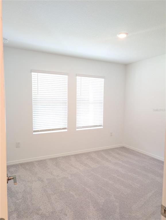 152 Jones Fish Camp Road Edgewater, FL 32141 - Photo 15 of 28 an empty room with a window