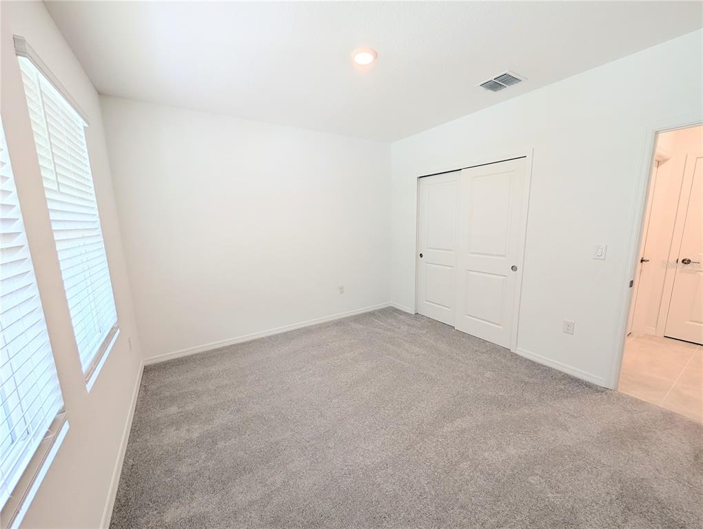 152 Jones Fish Camp Road Edgewater, FL 32141 - Photo 16 of 28 an empty room with windows