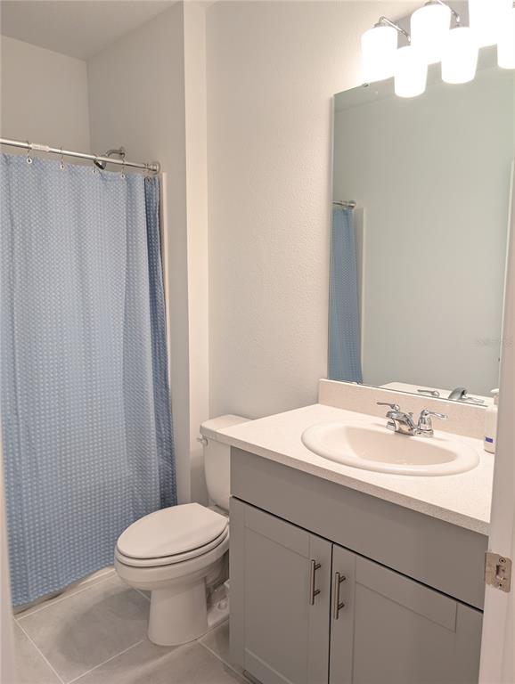 152 Jones Fish Camp Road Edgewater, FL 32141 - Photo 17 of 28 a bathroom with a sink a toilet and vanity