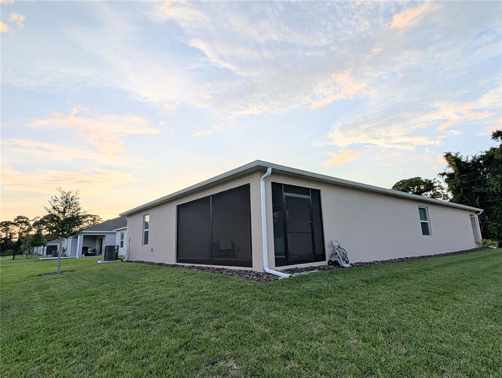 152 Jones Fish Camp Road Edgewater, FL 32141 - Photo 24 of 28 a view of a backyard with potted plants and large trees