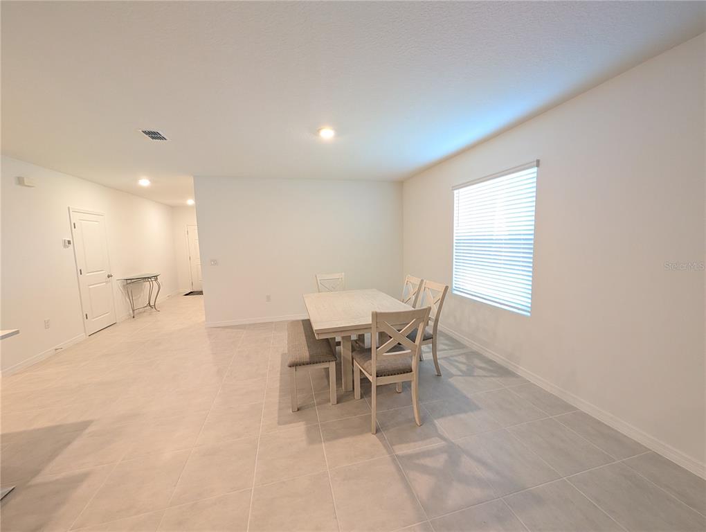 152 Jones Fish Camp Road Edgewater, FL 32141 - Photo 7 of 28 a view of a dining room with furniture