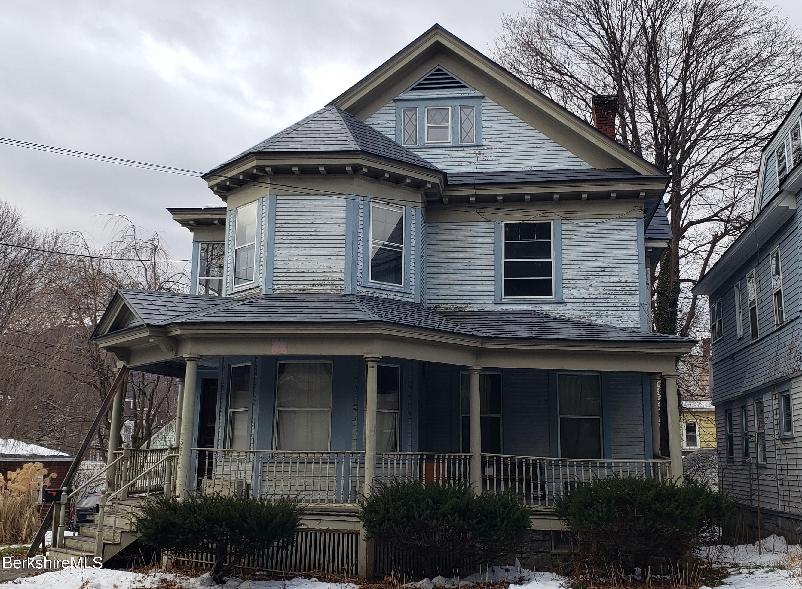 a front view of a house with yard