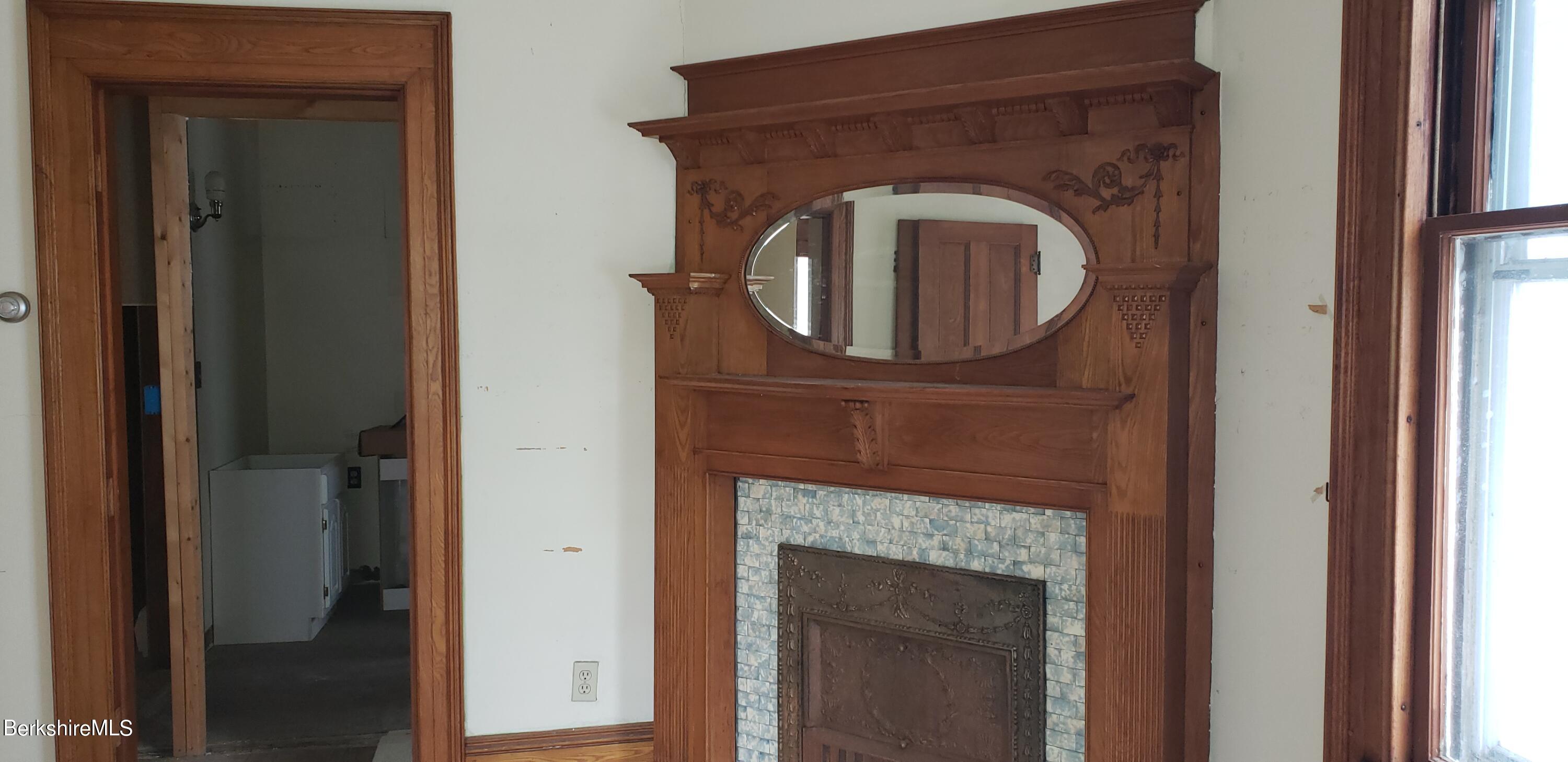 219-221 Church Street North Adams, MA 01247 - Photo 19 of 43 a close view of a fireplace