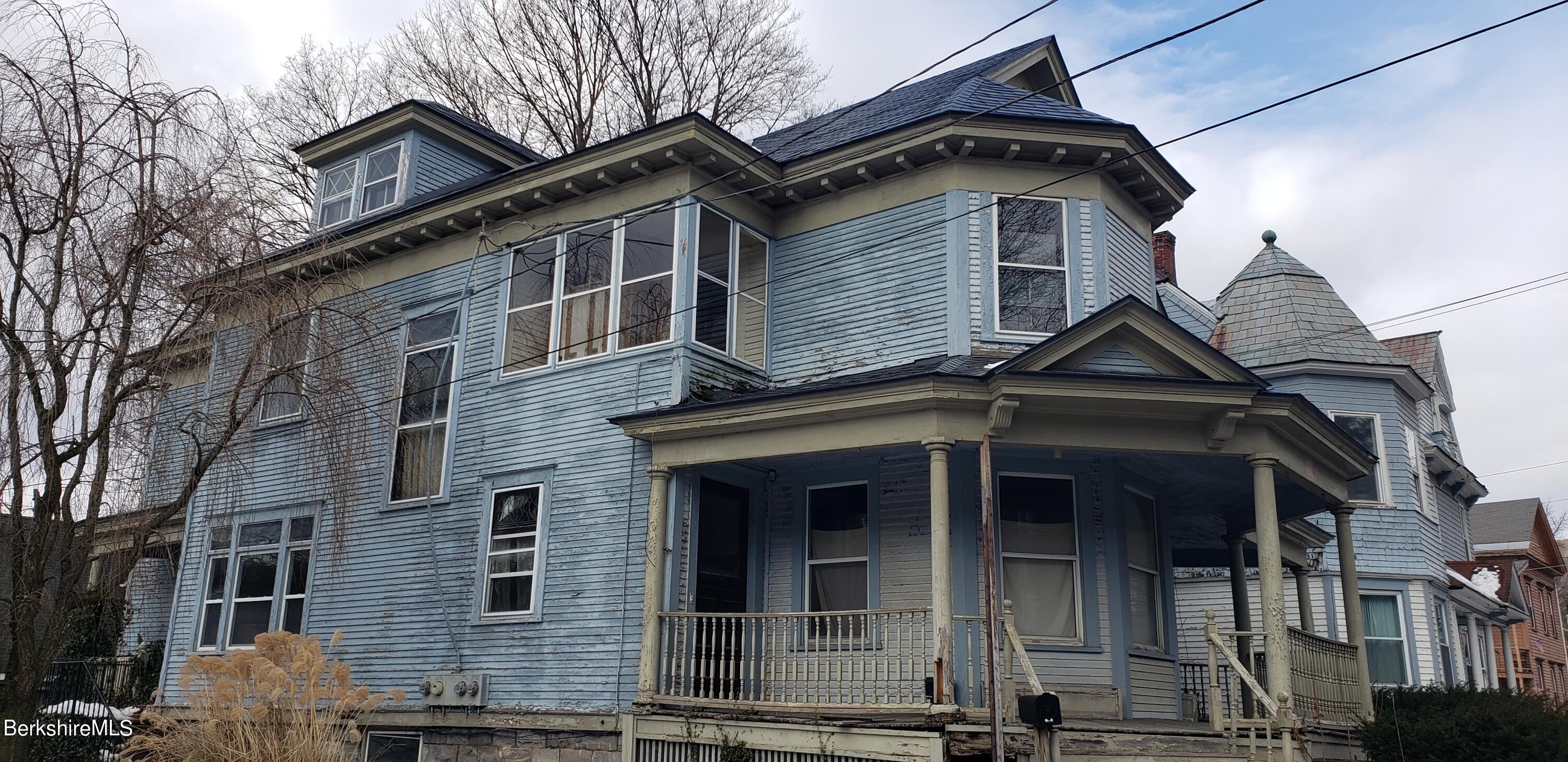 219-221 Church Street North Adams, MA 01247 - Photo 2 of 43 a front view of a house