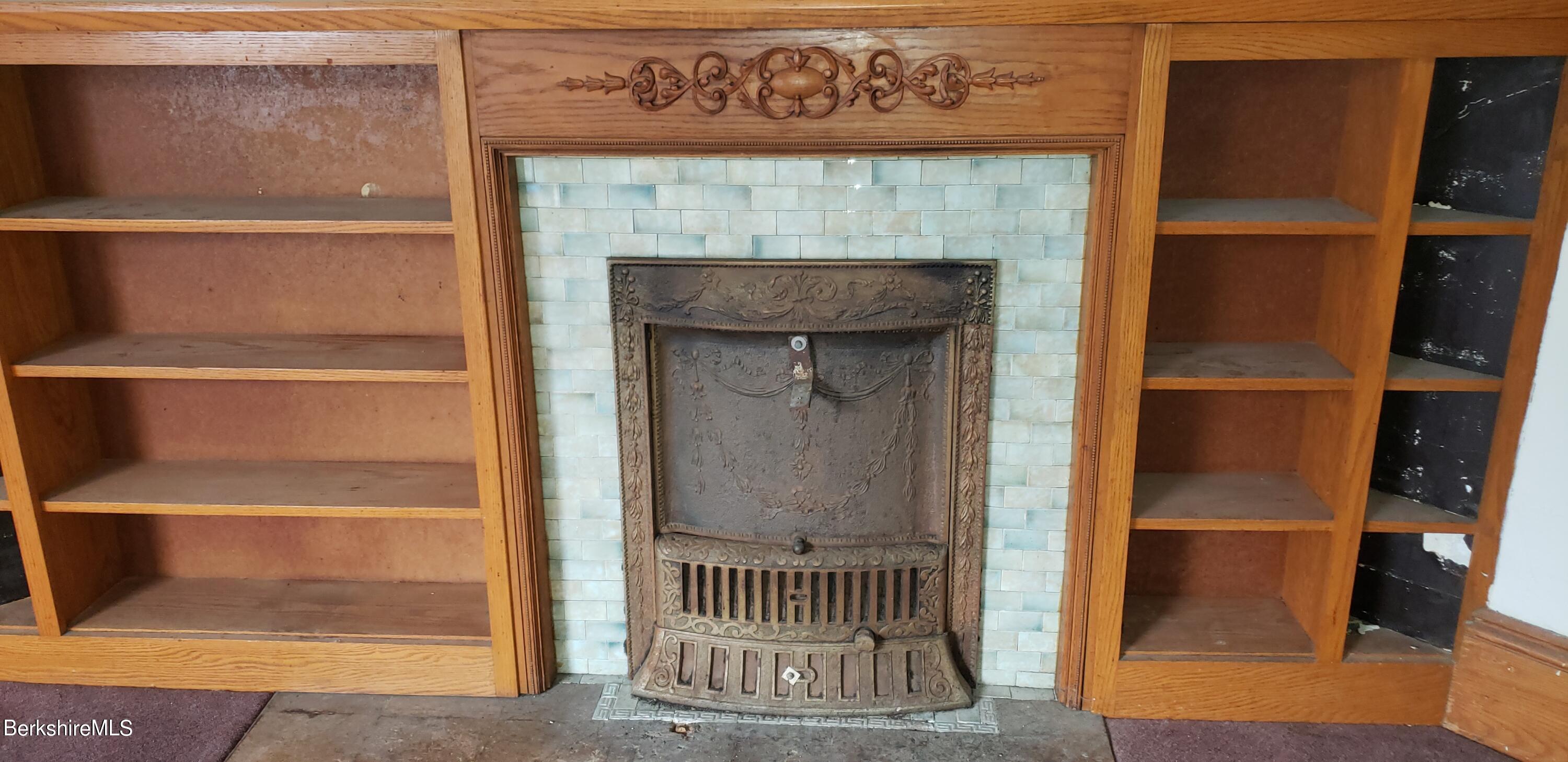 219-221 Church Street North Adams, MA 01247 - Photo 21 of 43 a front door view with a fireplace