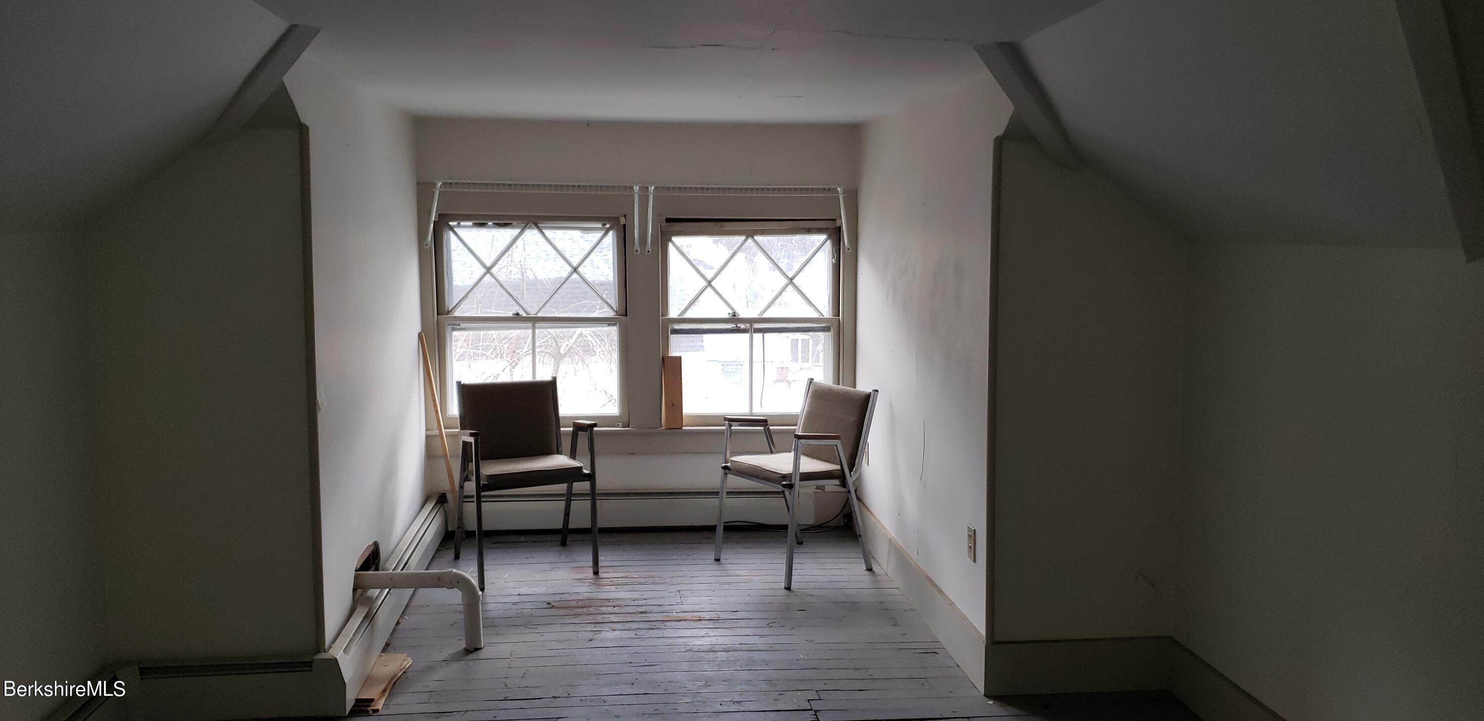 219-221 Church Street North Adams, MA 01247 - Photo 22 of 43 a living room with furniture and a window