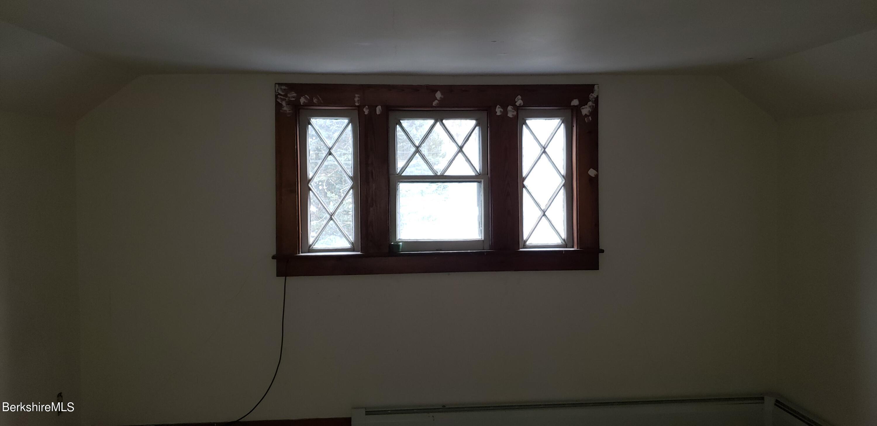 219-221 Church Street North Adams, MA 01247 - Photo 23 of 43 a view of a window in an empty room