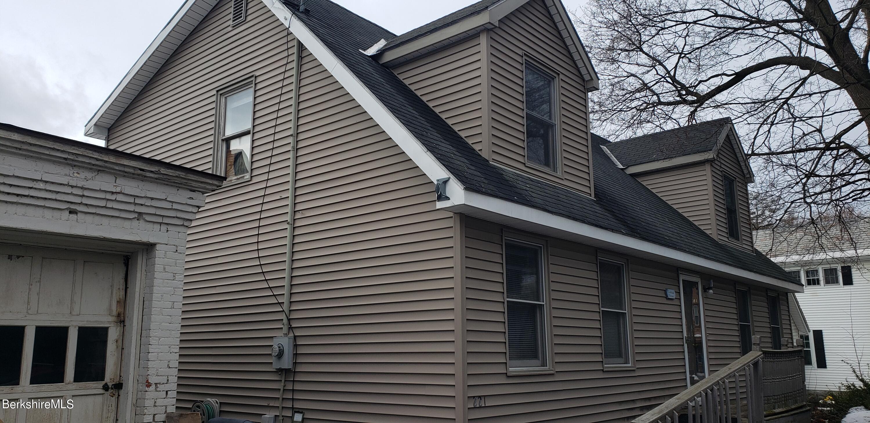 219-221 Church Street North Adams, MA 01247 - Photo 28 of 43 a front view of a house with a street