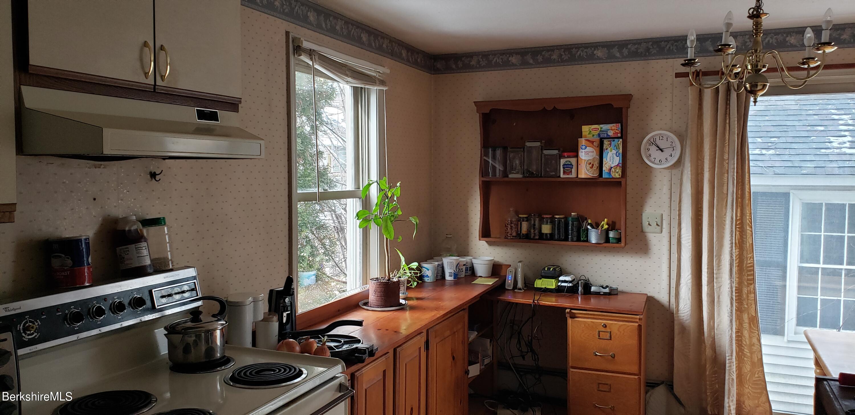 219-221 Church Street North Adams, MA 01247 - Photo 31 of 43 a view of a kitchen with a sink and cabinets