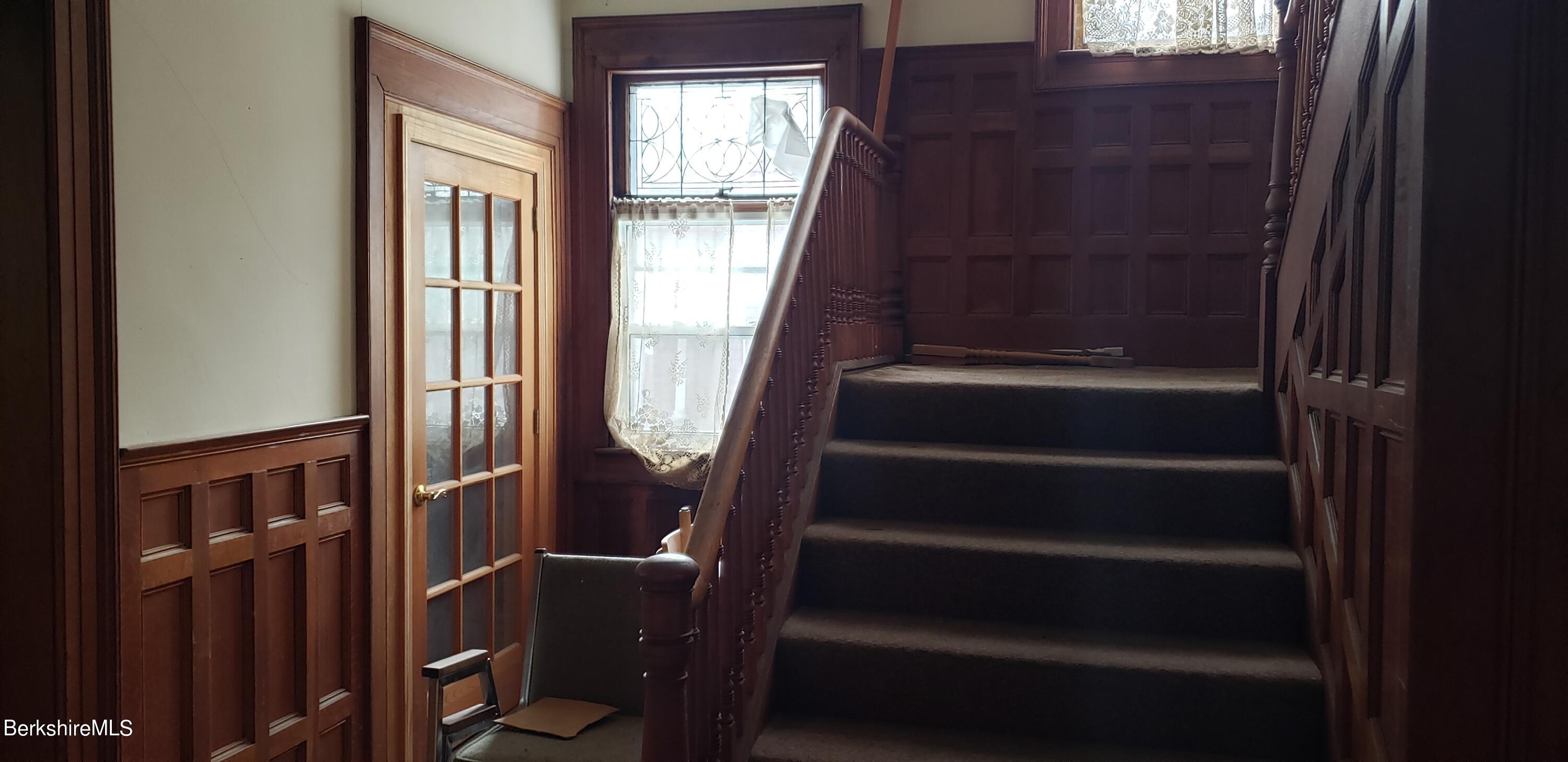 219-221 Church Street North Adams, MA 01247 - Photo 7 of 43 a view of entryway with wooden floor and windows