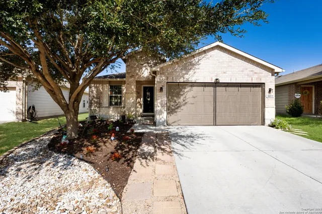 a backyard of a house with garden and porch