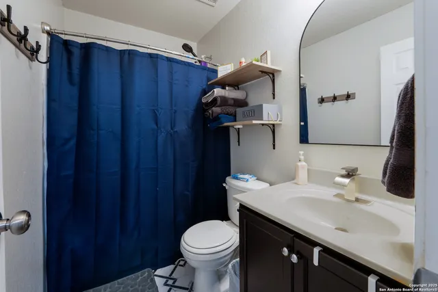 a bathroom with a sink and a toilet