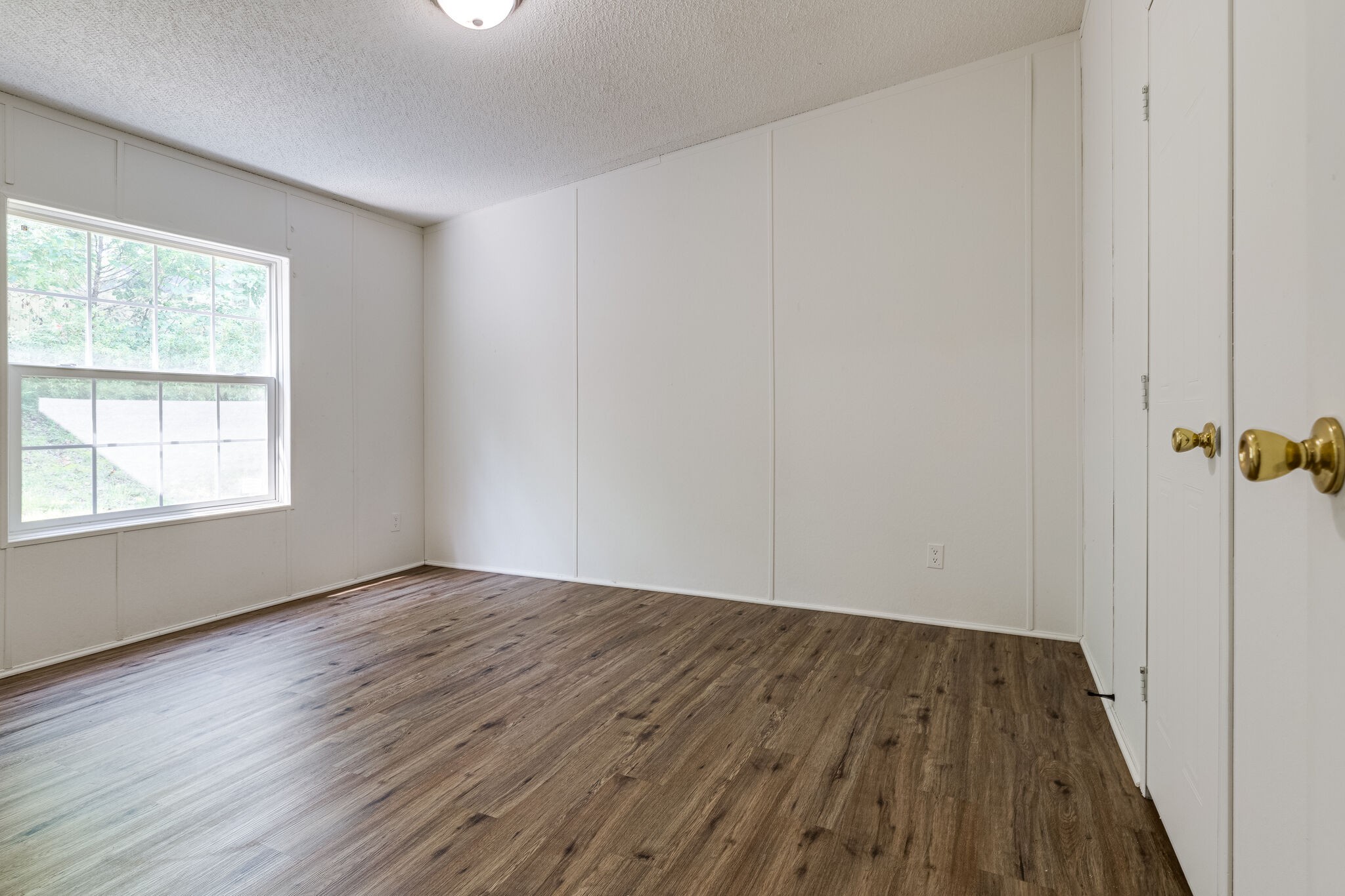 230 East Piney Road Dickson, TN 37055 - Photo 15 of 18 a view of an empty room with wooden floor and a window
