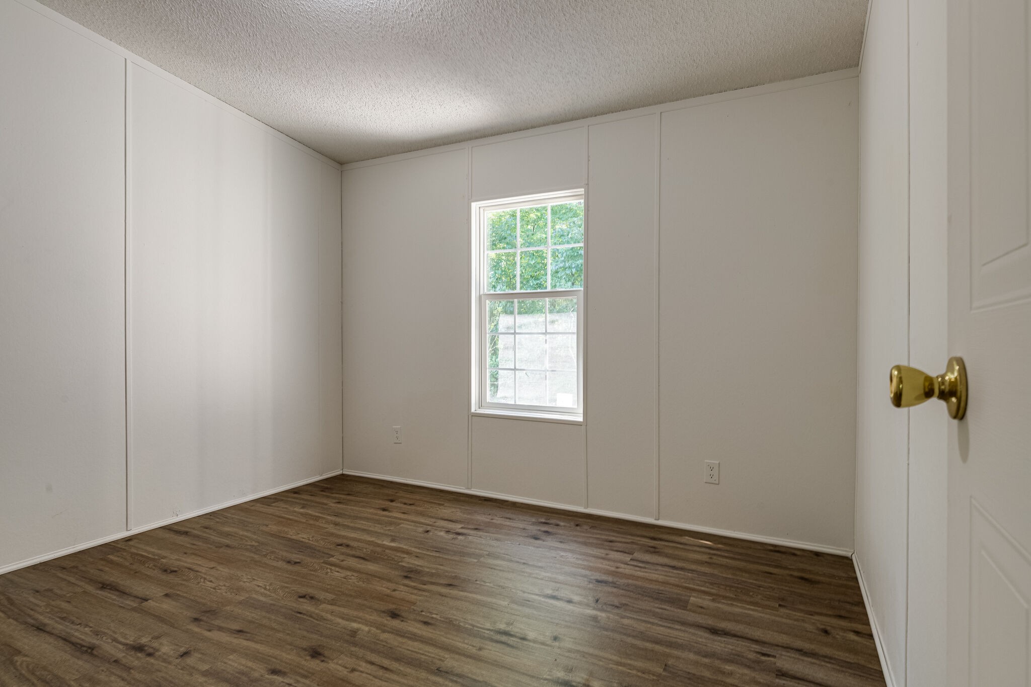 230 East Piney Road Dickson, TN 37055 - Photo 17 of 18 a view of an empty room with wooden floor and a window