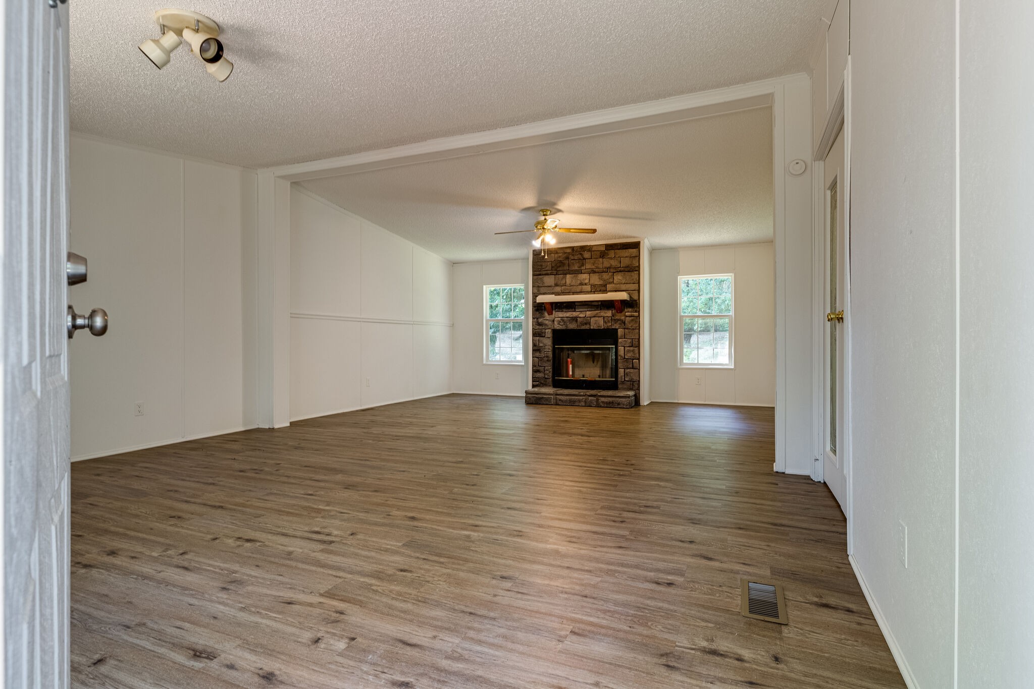 230 East Piney Road Dickson, TN 37055 - Photo 2 of 18 a view of empty room with a fireplace and wooden floor