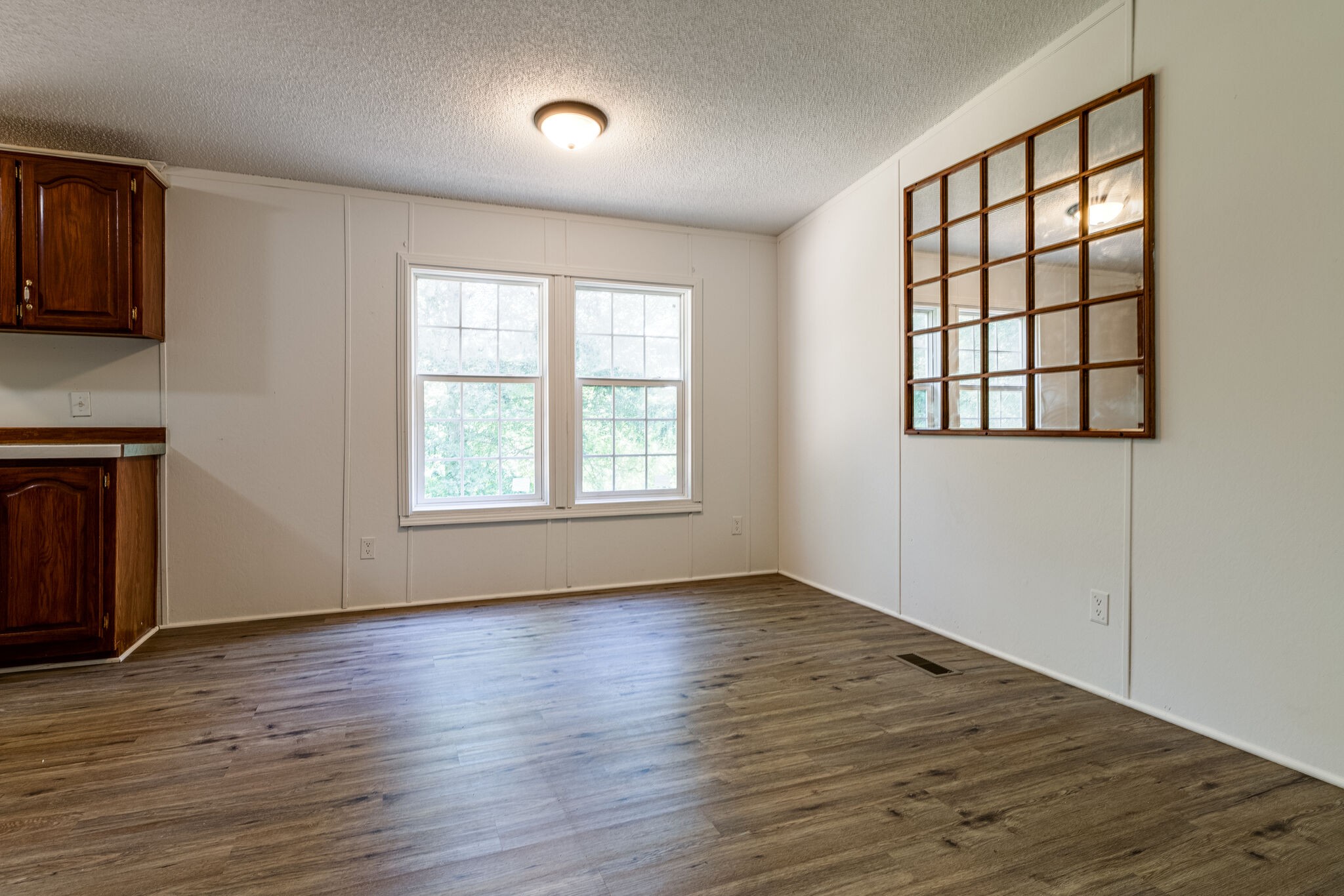 230 East Piney Road Dickson, TN 37055 - Photo 4 of 18 an empty room with wooden floor and windows