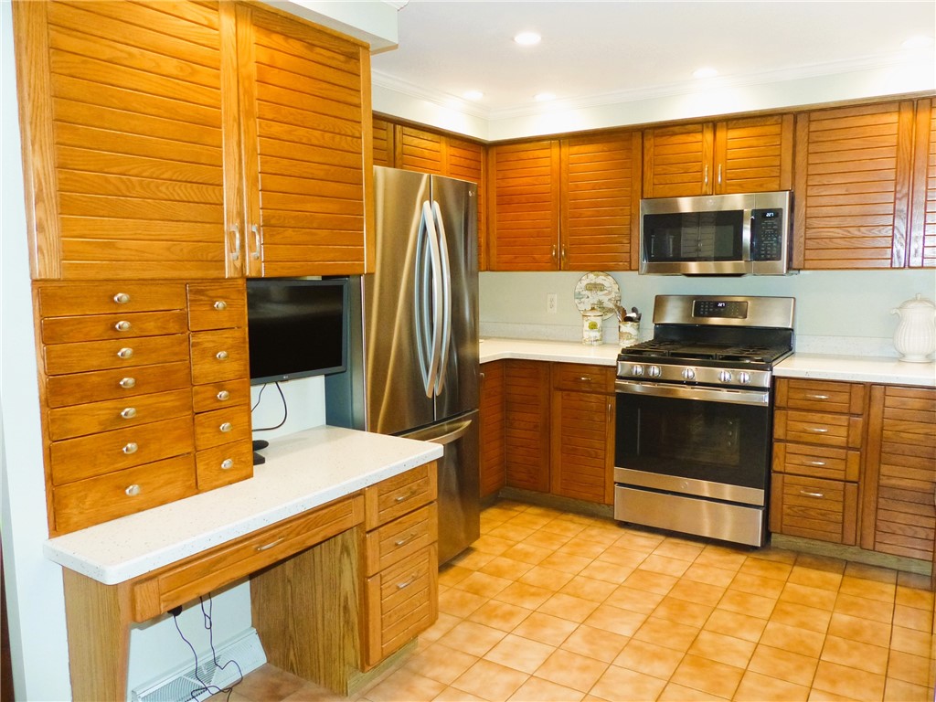 2 Shingle Mill Road Irondequoit, NY 14609 - Photo 9 of 36 Kitchen with stainless steel appliances and solid