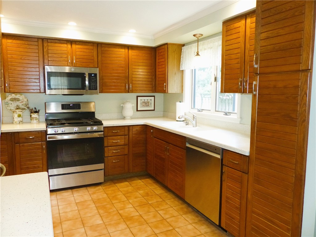 2 Shingle Mill Road Irondequoit, NY 14609 - Photo 10 of 36 Kitchen with stainless steel appliances and solid