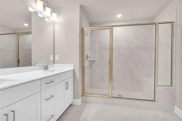 a bathroom with a double vanity sink and a mirror