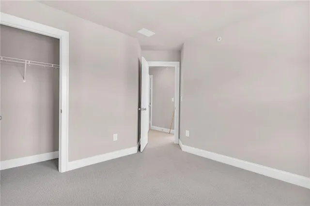 an empty room with closet area