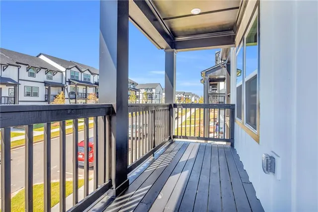 a view of balcony with wooden floor