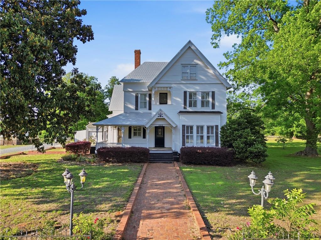 880 Johnstonville Road Barnesville, GA 30204 - Photo 2 of 33 a front view of a house with garden