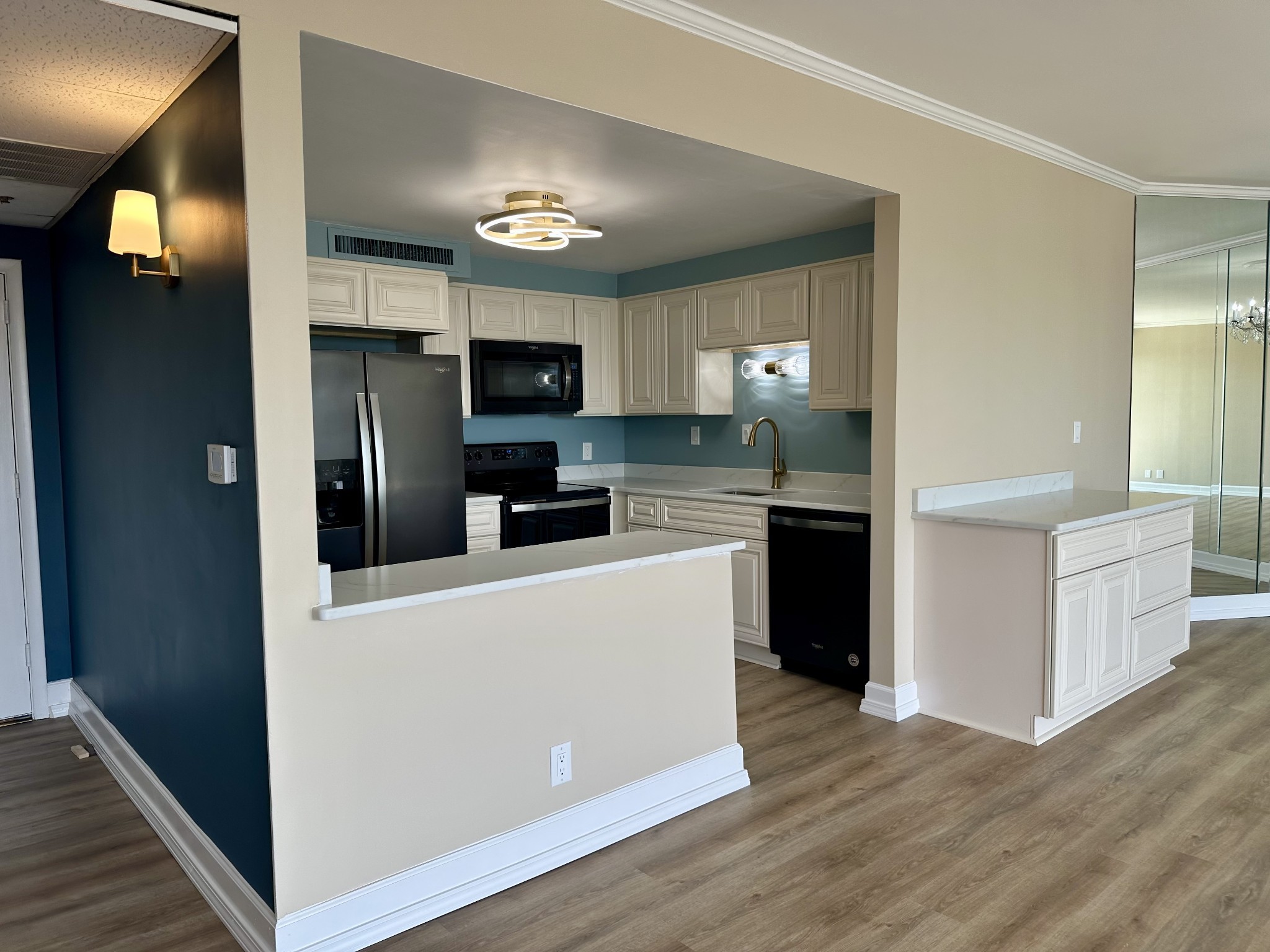 4215 Harding Pike, Unit 903 Nashville, TN 37205 - Photo 13 of 68 a kitchen with kitchen island a refrigerator and a stove top oven