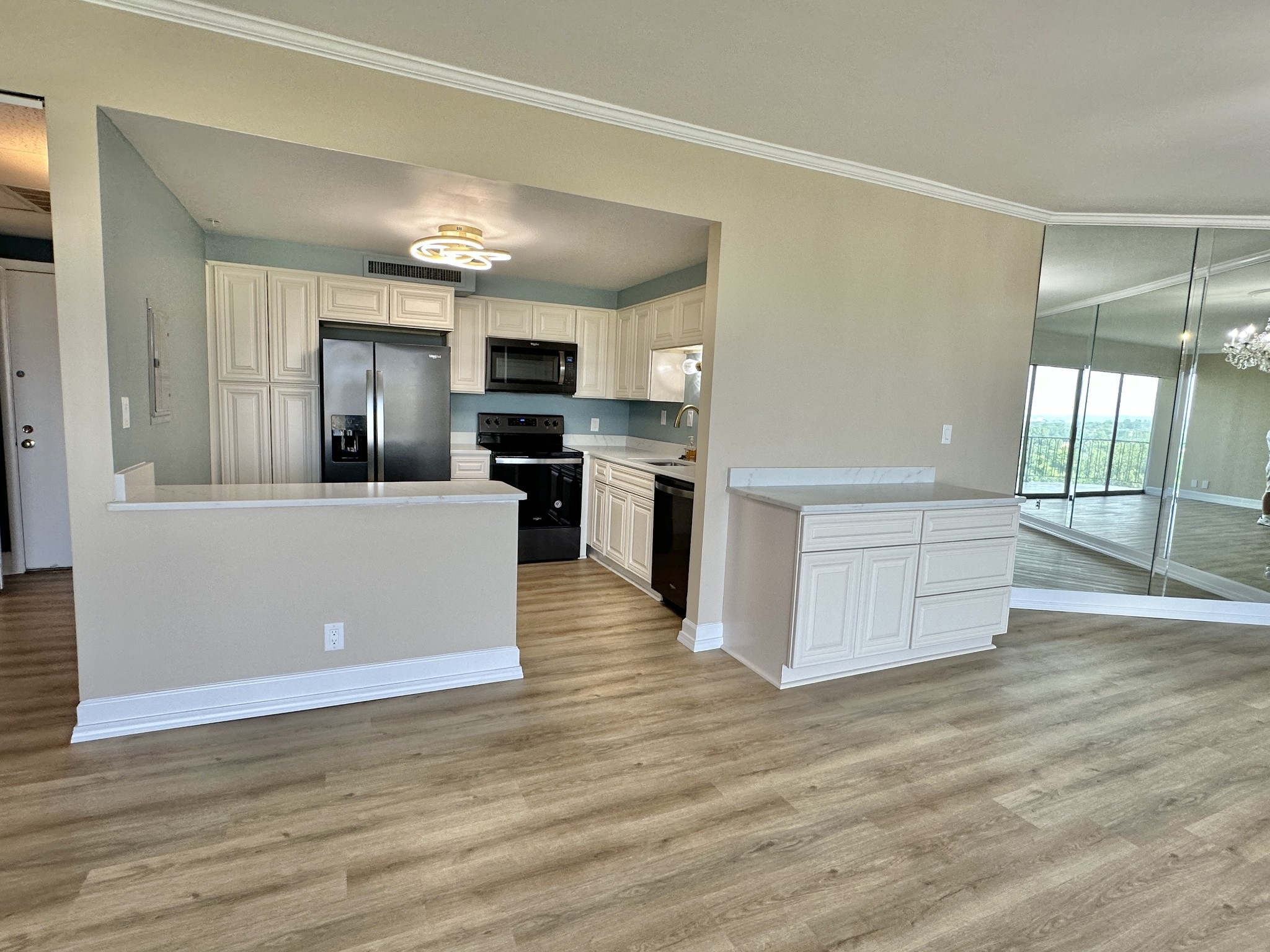 4215 Harding Pike, Unit 903 Nashville, TN 37205 - Photo 15 of 68 a large kitchen with a center island and wooden floor