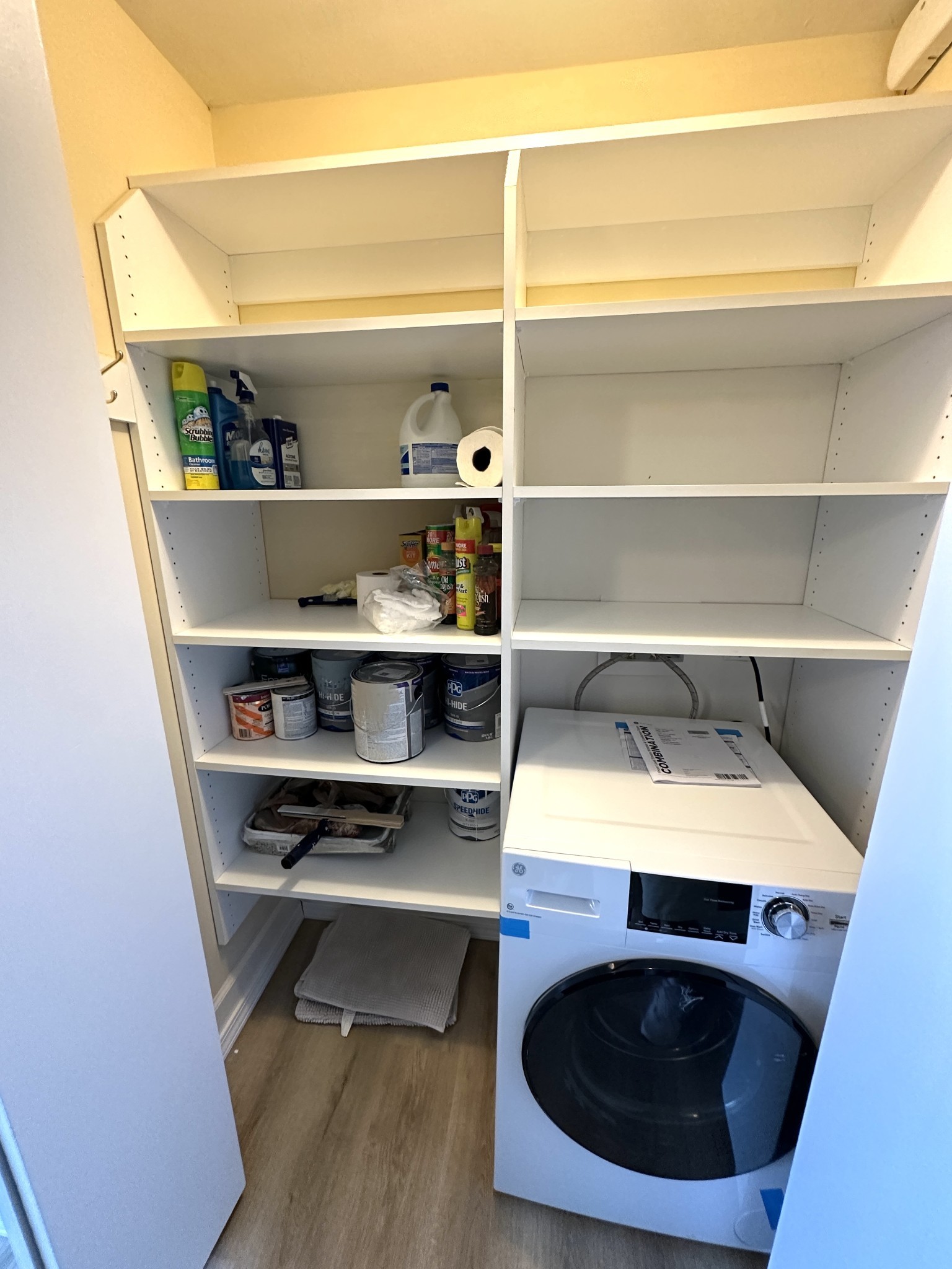 4215 Harding Pike, Unit 903 Nashville, TN 37205 - Photo 25 of 68 a view of washer and dryer with wooden floor