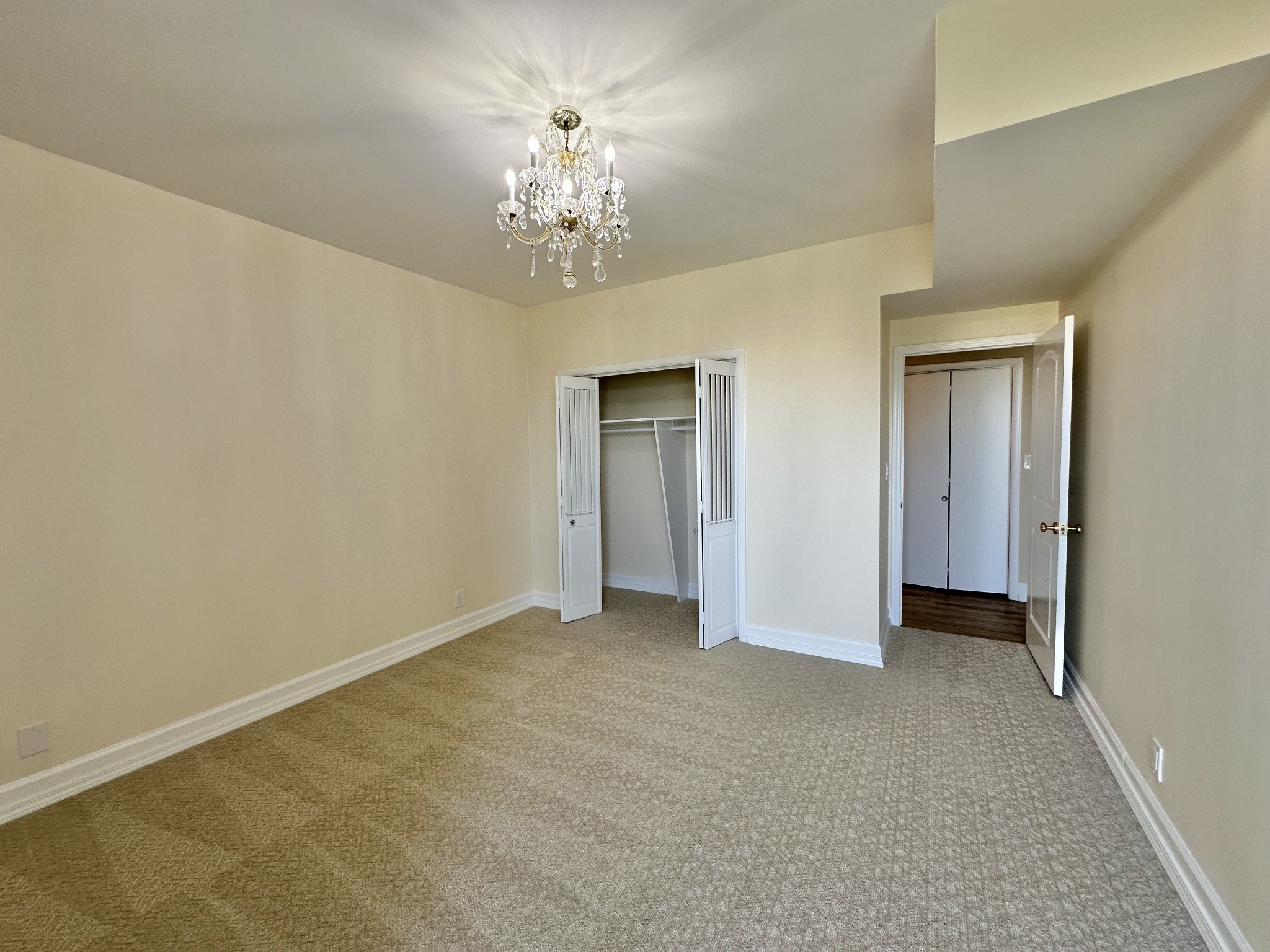 4215 Harding Pike, Unit 903 Nashville, TN 37205 - Photo 36 of 68 a view of an empty room with chandelier