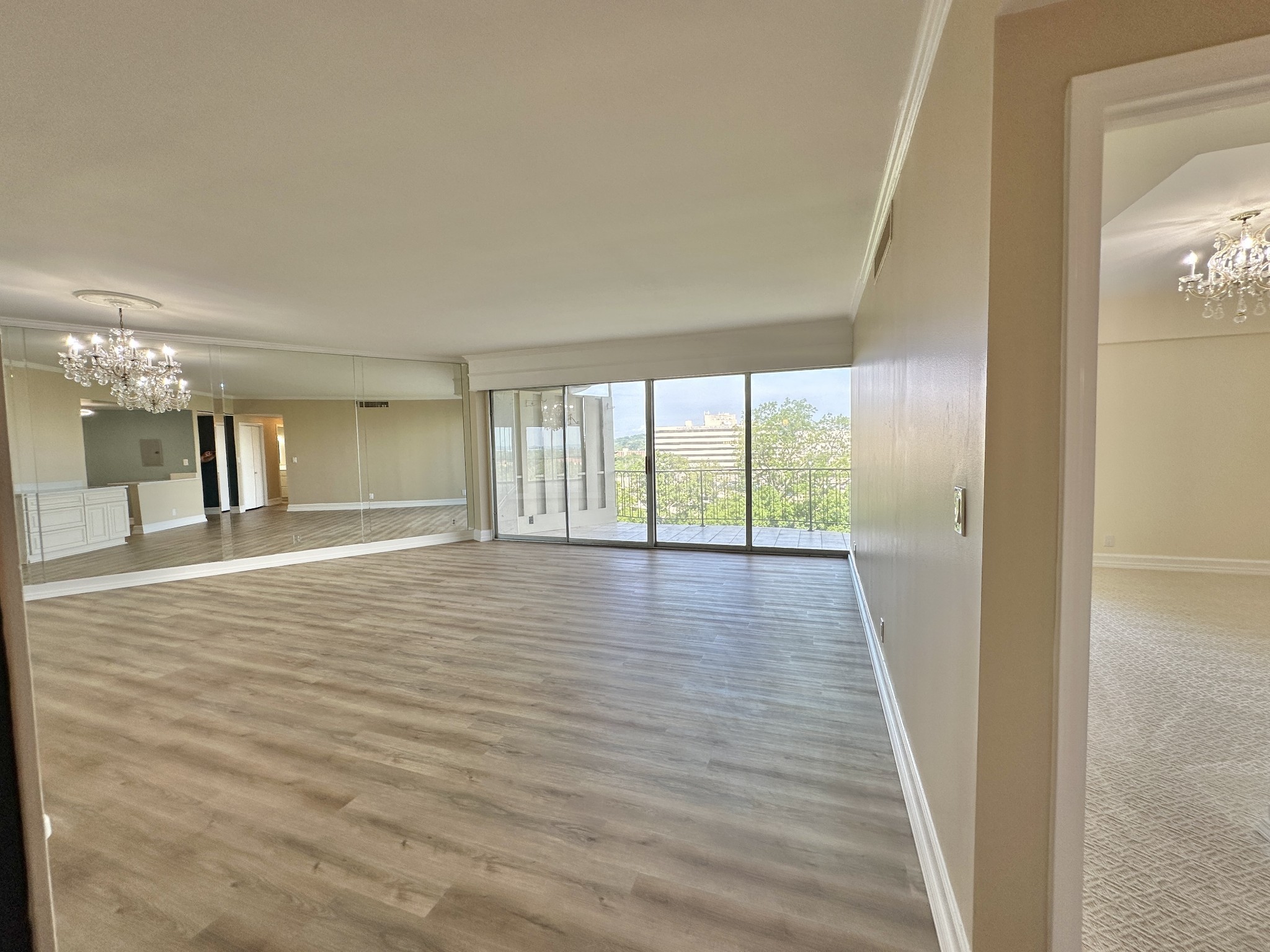 4215 Harding Pike, Unit 903 Nashville, TN 37205 - Photo 7 of 68 a view of an empty room with wooden floor and a window