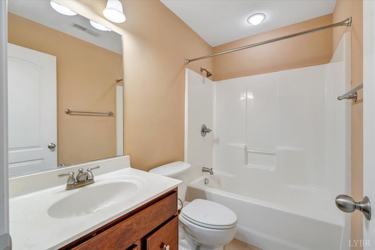 1250 Our Cove Road Huddleston, VA 24104 - Photo 43 of 70 a bathroom with a sink a toilet and shower