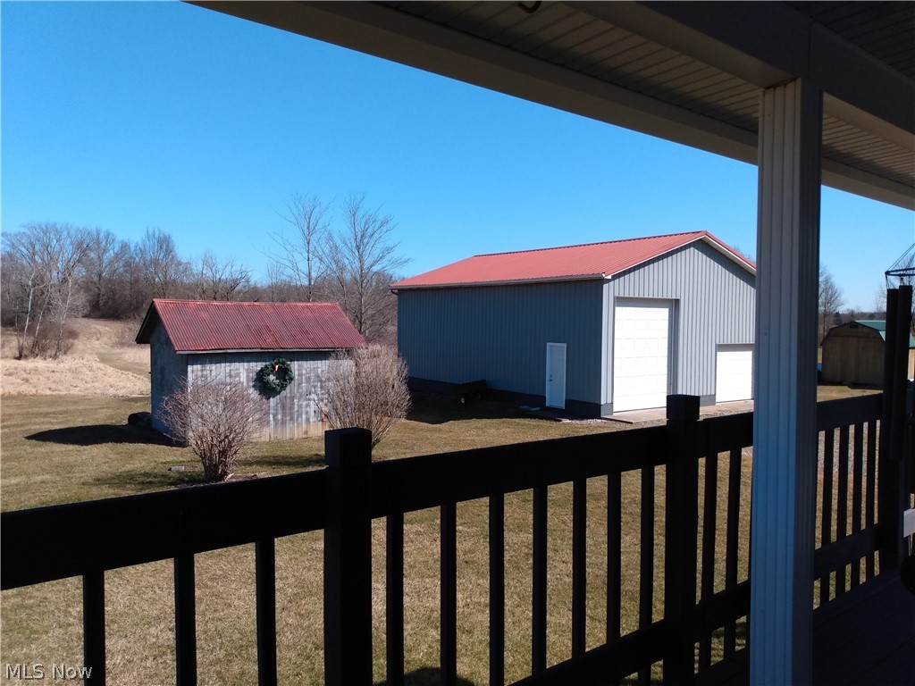 9643 Tallmadge Road Diamond, OH 44412 - Photo 35 of 35 Decking wraps around the back with sliding glass doors to enjoy the beautiful country views.