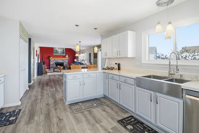 a kitchen with cabinets a sink and appliances