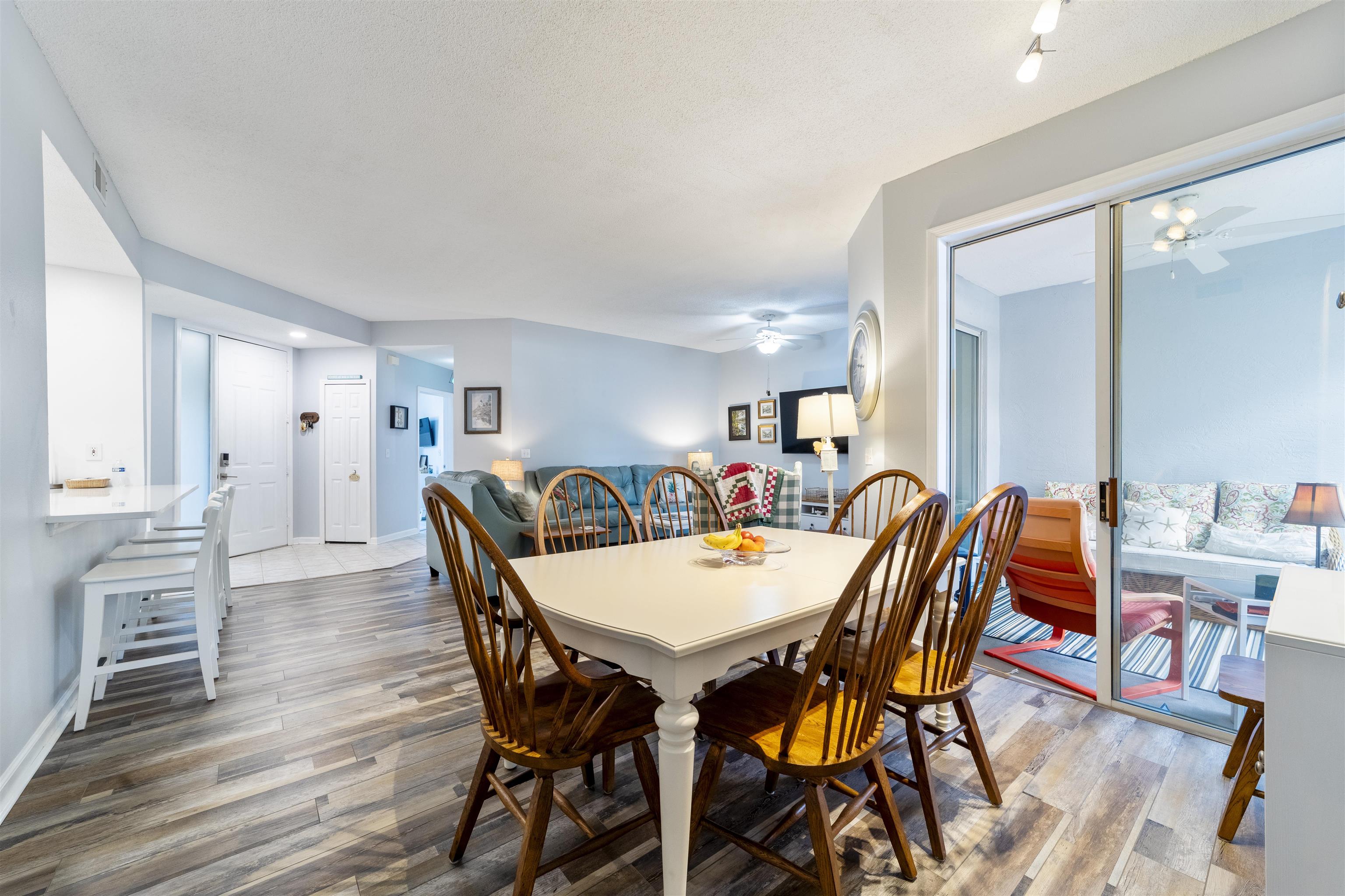 208 Augusta Circle St. Augustine, FL 32086 - Photo 14 of 34 a view of a dining room with furniture and wooden floor