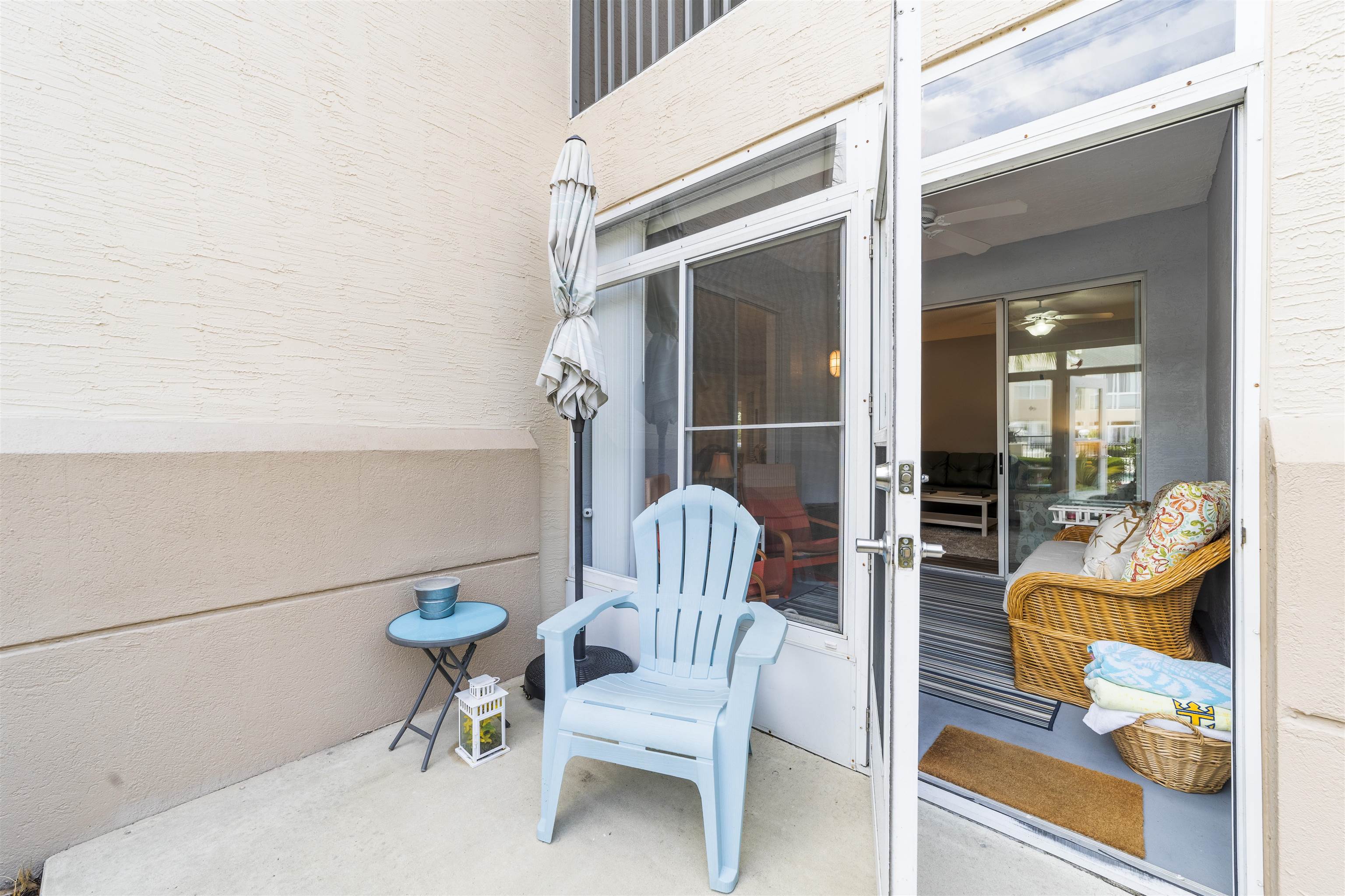 208 Augusta Circle St. Augustine, FL 32086 - Photo 19 of 34 a chair and a table in a balcony