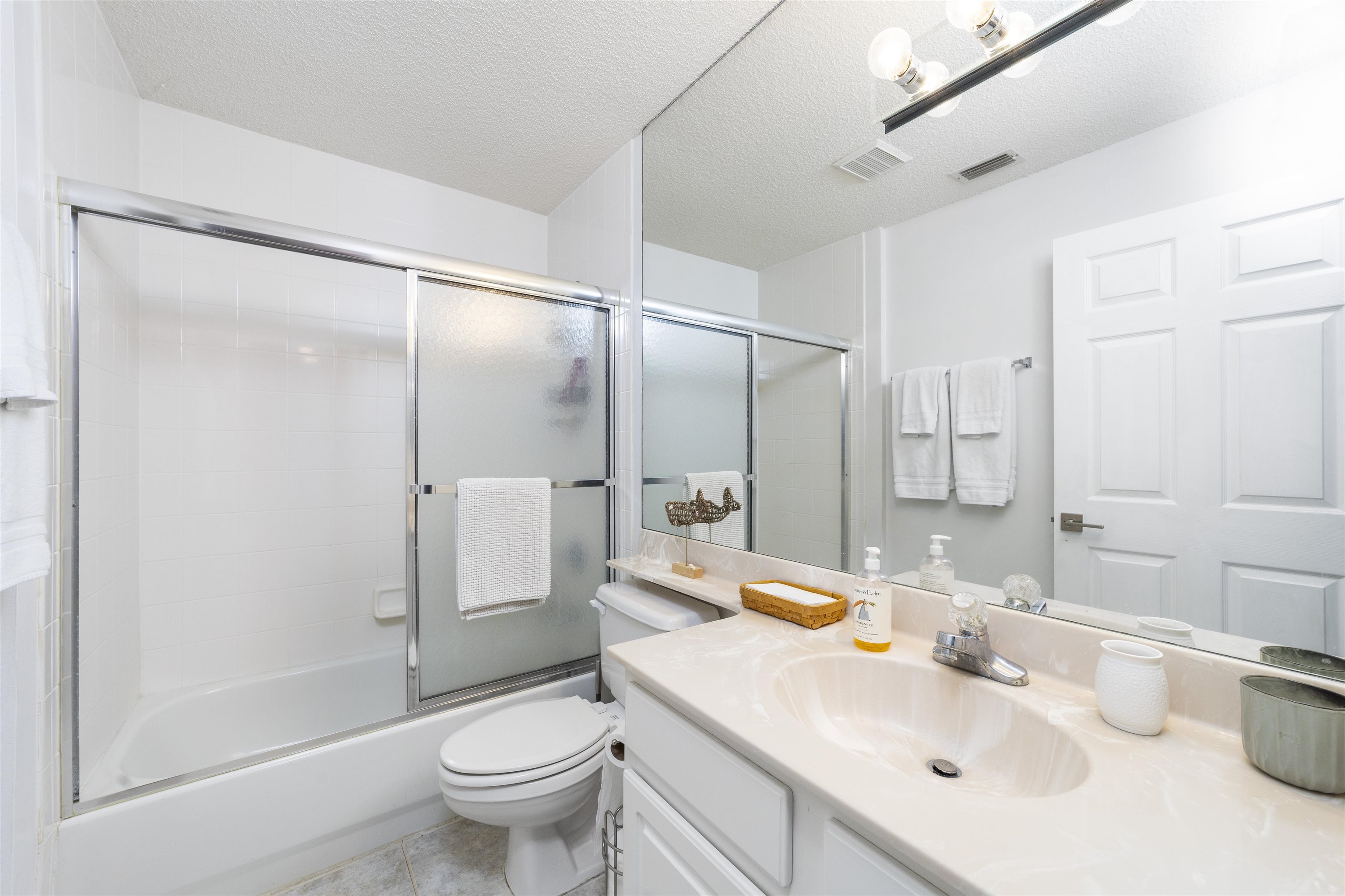 208 Augusta Circle St. Augustine, FL 32086 - Photo 31 of 34 a bathroom with a sink toilet and shower