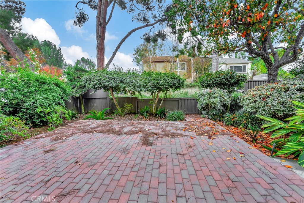106 Sequoia Tree Lane Irvine, CA 92612 - Photo 12 of 12 a front view of a house with a yard and a garden