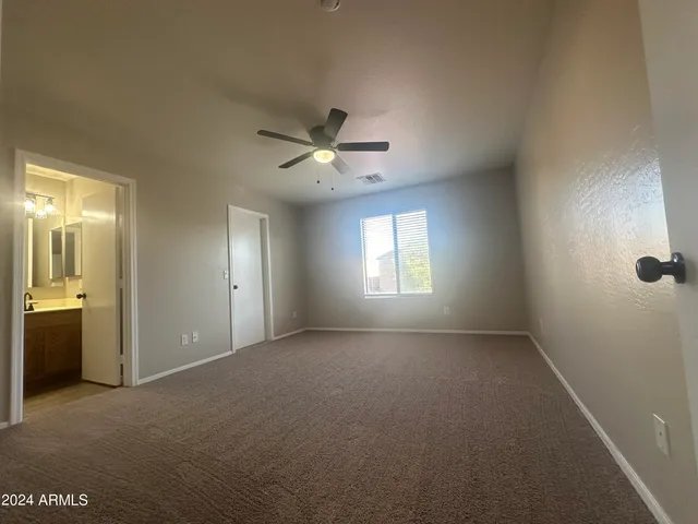 a bathroom with a sink a toilet a mirror and vanity