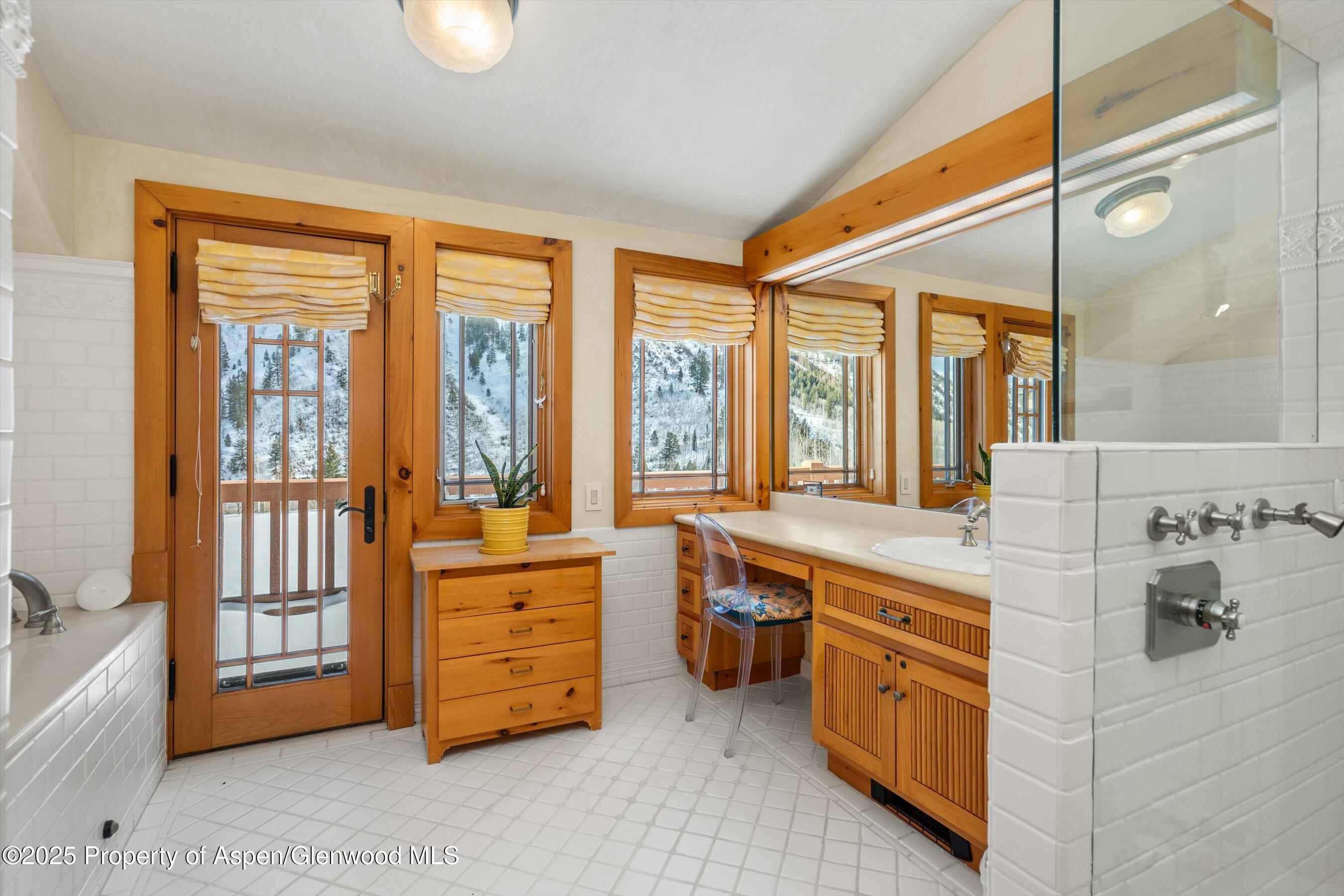 195 North Hayden Road Aspen, CO 81611 - Photo 19 of 39 a large spacious bathroom with a large tub and sink