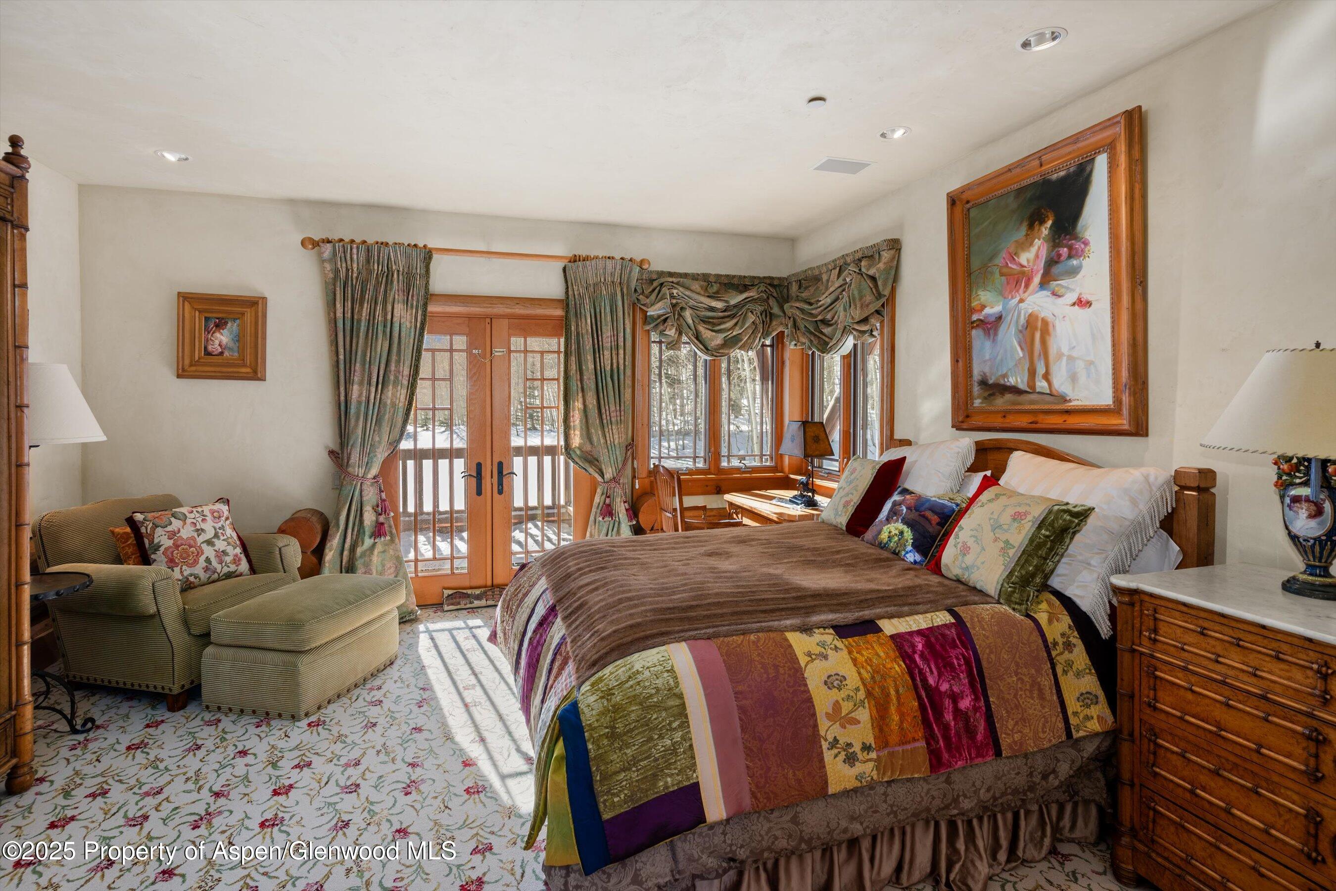 195 North Hayden Road Aspen, CO 81611 - Photo 22 of 39 a bedroom with a bed couch and window