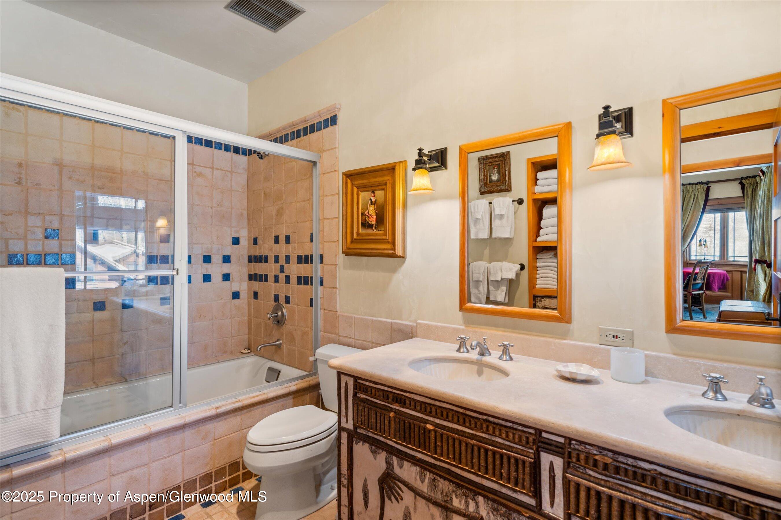 195 North Hayden Road Aspen, CO 81611 - Photo 26 of 39 a bathroom with a granite countertop sink toilet and shower