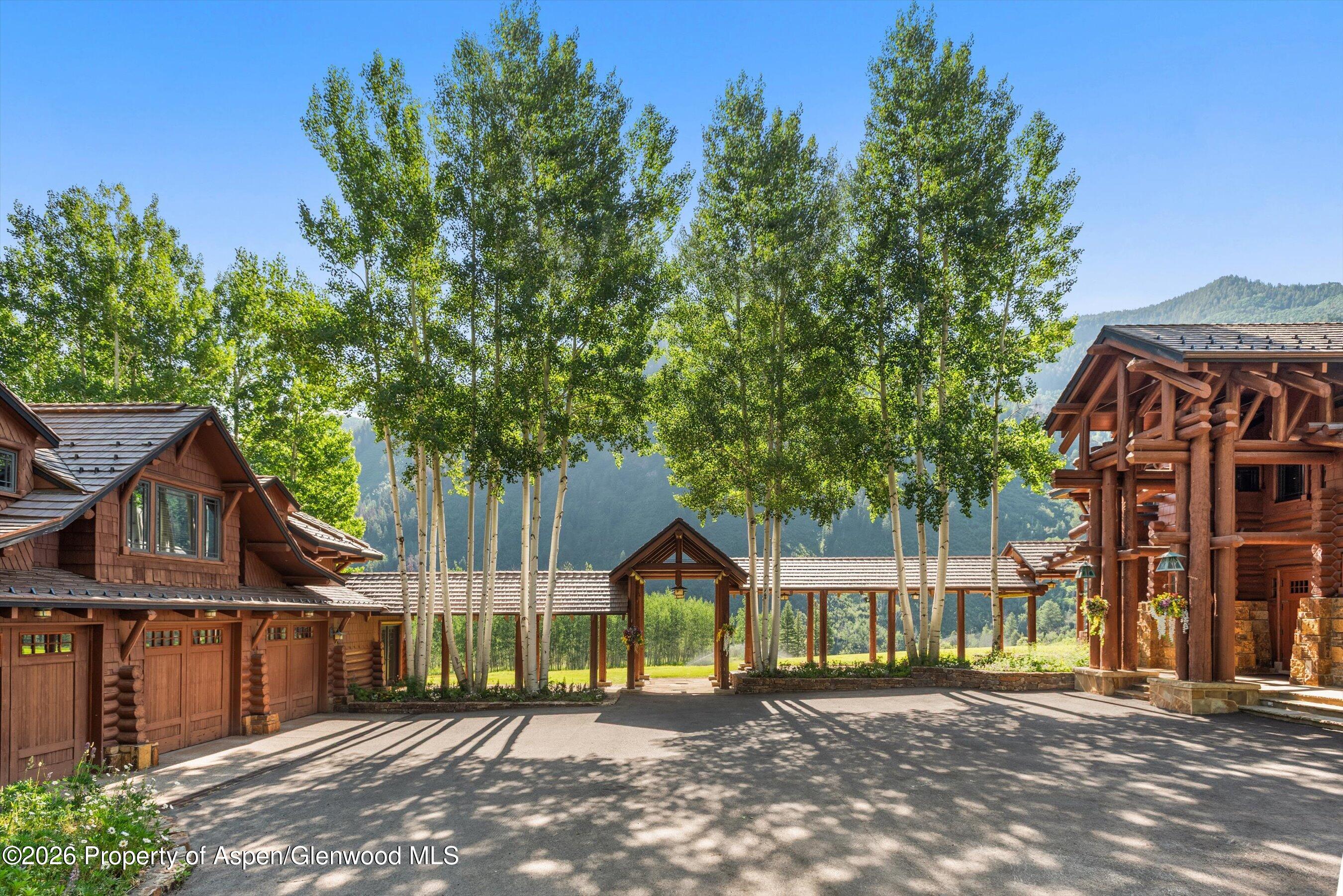 195 North Hayden Road Aspen, CO 81611 - Photo 4 of 39 front view of a house with a tree