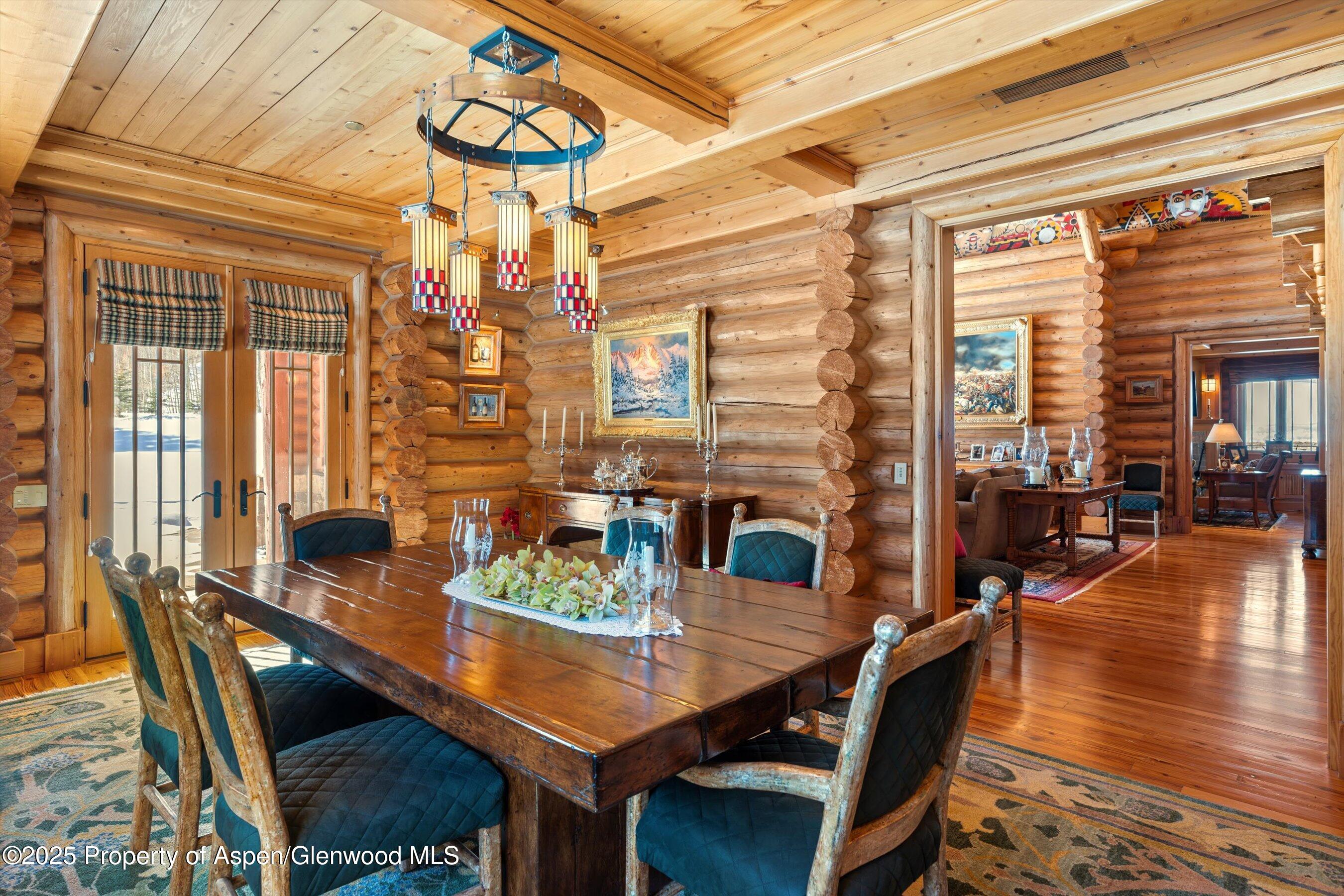 195 North Hayden Road Aspen, CO 81611 - Photo 8 of 39 a view of a dining room with furniture window and wooden floor