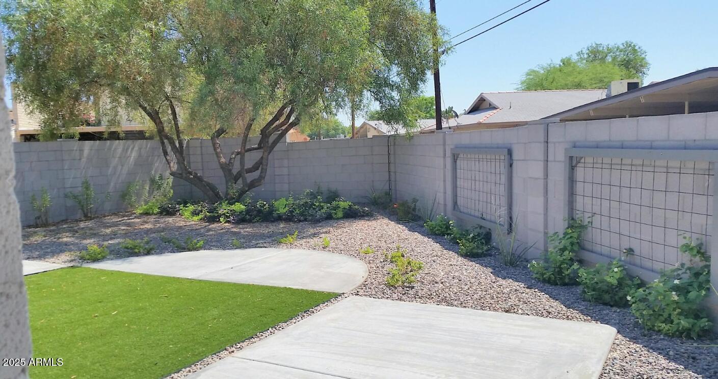 4351 North 36th Place, Unit 3 Phoenix, AZ 85018 - Photo 5 of 11 a view of a backyard with large trees