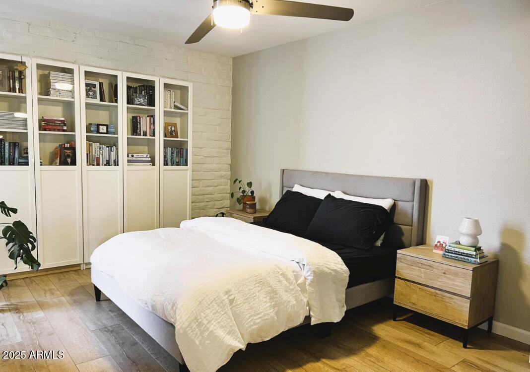 4351 North 36th Place, Unit 3 Phoenix, AZ 85018 - Photo 8 of 11 a bedroom with a bed and a potted plant