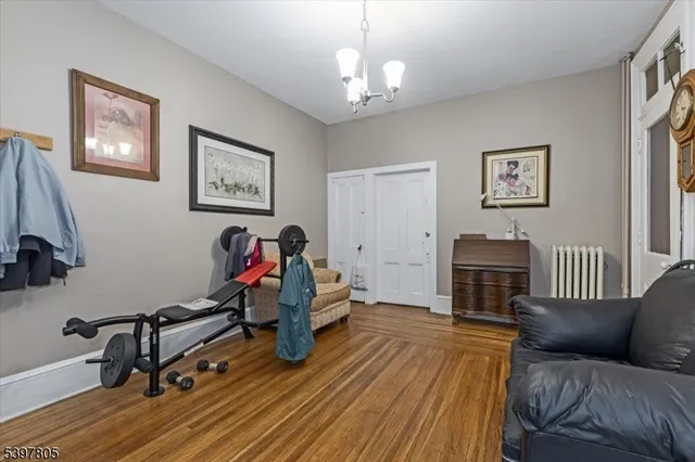 a view of a livingroom with furniture and a workspace