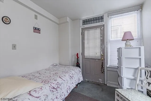 a bedroom with a bed and cabinets