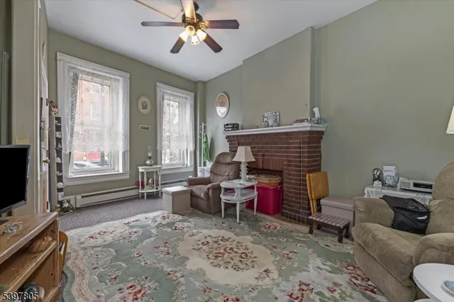 a living room with furniture and a fireplace